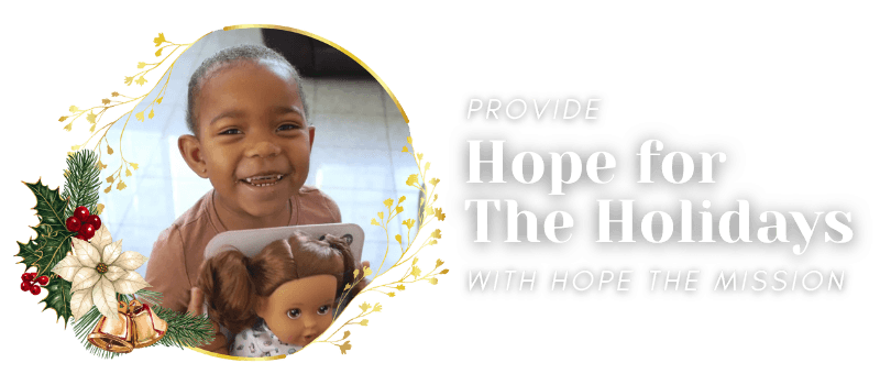 Two women hugging and smiling joyfully while taking a selfie together.